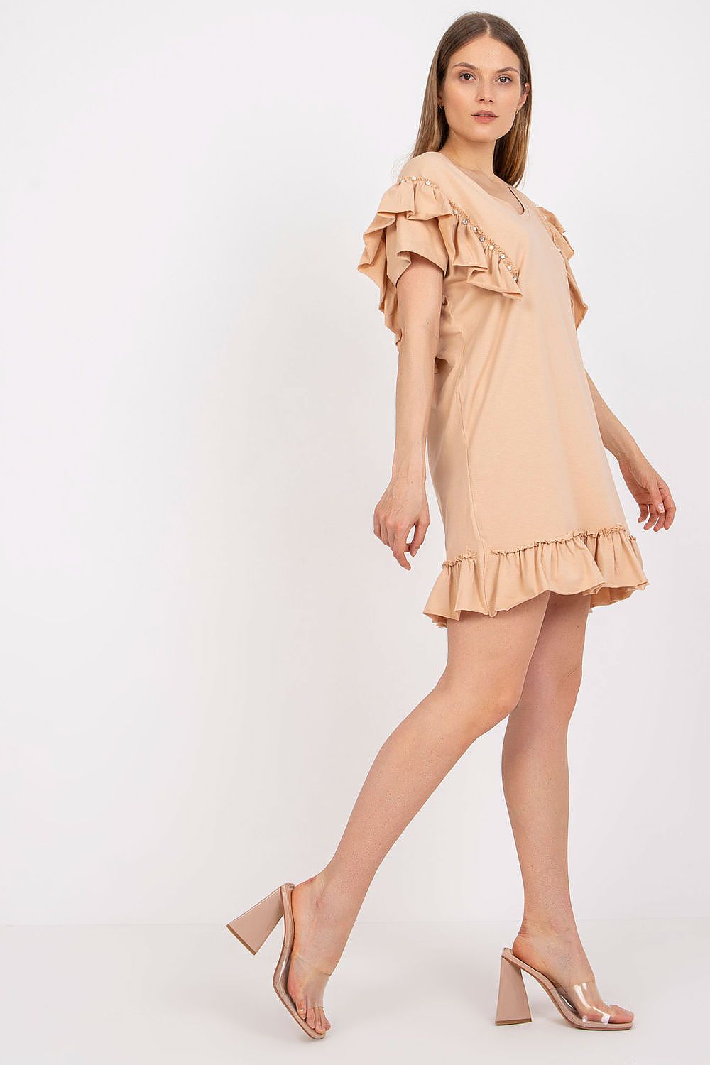 Side profile of the Elegant Straight Cut Daydress with Frills and Zircons in beige, highlighting its chic design and luxurious fabric blend, perfect for a refined look.