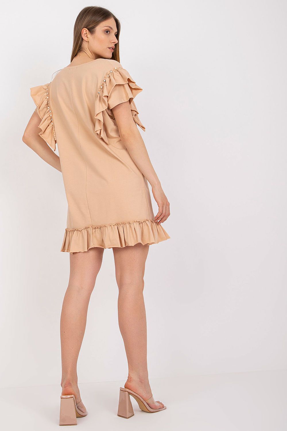 Elegant straight cut daydress with frills and zircons, showcasing a luxurious cotton and spandex blend. The model is seen from the back, highlighting the ruffled sleeves and chic design, perfect for any occasion.