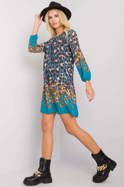 Luxurious Och Bella Loose-Fitting Daydress with 3/4 Sleeves and Rounded Neckline, showcasing a fashionable side view with intricate floral details at the hem.
