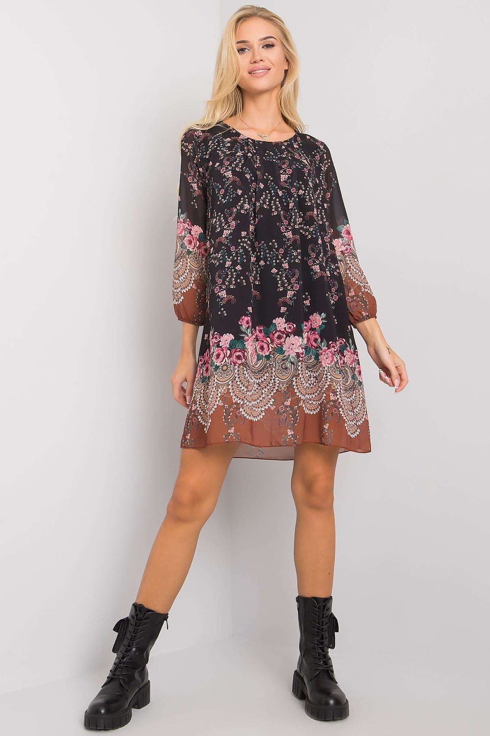 Luxurious Och Bella Loose-Fitting Daydress with 3/4 Sleeves and Rounded Neckline, epitomising luxury with its floral adornments on a chic black background, complemented by fashionable black lace-up boots.