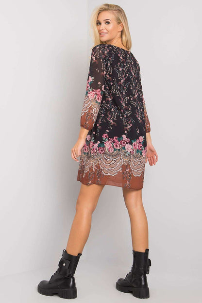 Luxurious Och Bella Loose-Fitting Daydress with 3/4 Sleeves and Rounded Neckline, featuring a rear view of the dress worn by a model, accentuating the intricate floral patterns and relaxed fit.