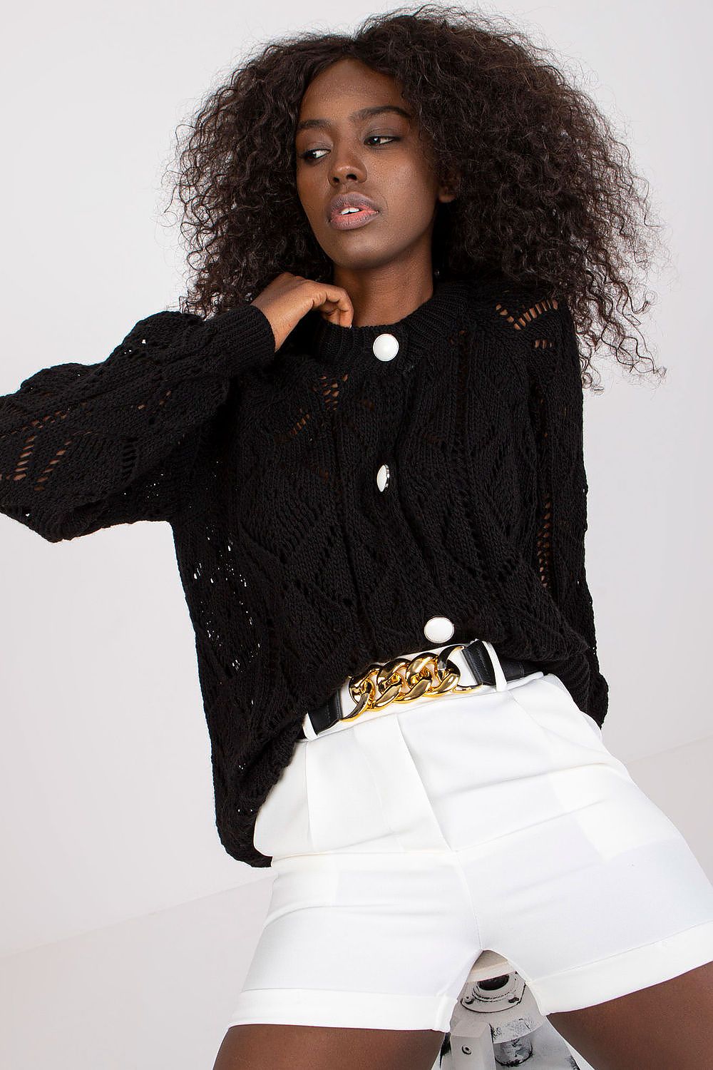 Chic styling of Luxury Women's Elastic Waistband Shorts With Slip Pockets and Decorative Belt By Italy Moda, styled with a black knitted cardigan and eye-catching details for a luxurious touch.