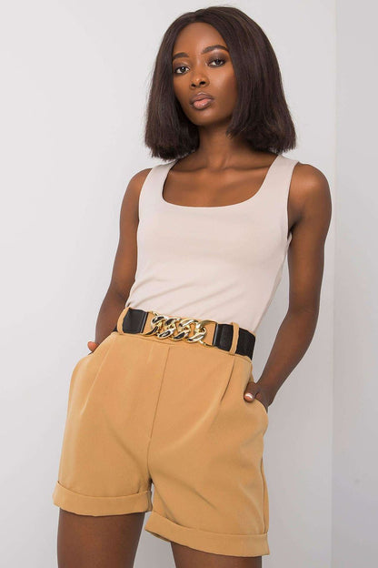 Fashion-forward model wearing Luxury Women's Elastic Waistband Shorts with Slip Pockets and Decorative Belt by Italy Moda, featuring beige tones for a refined appearance.