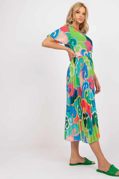 Elegant Italy Moda Summer Dress with Flared Cut, Belt and Lining - Short Sleeves, Perfect for Any Occasion, displayed by a model posing confidently in a colourful dress adorned with lively patterns, ideal for summer outings.