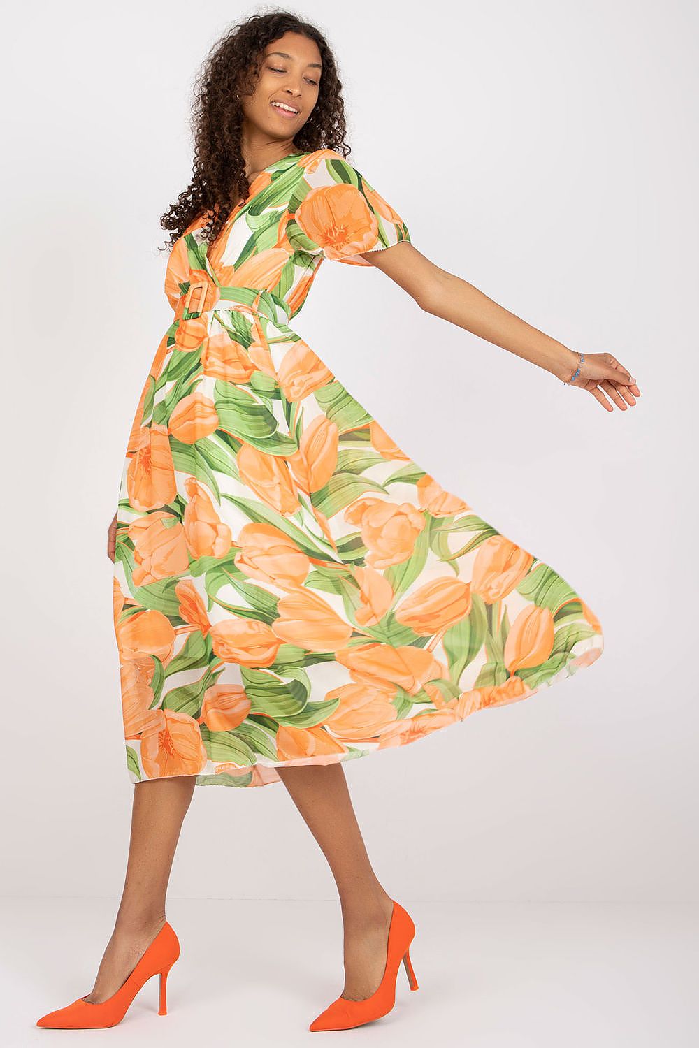 Elegant Summer Dress with Short Frilled Sleeves and Belted Waist by Italy Moda, featuring a vibrant floral design in orange and green, styled for a graceful twirl.