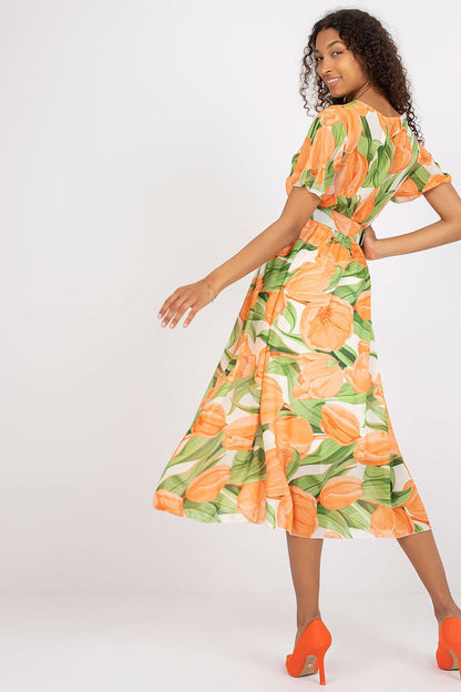 Elegant Summer Dress with Short Frilled Sleeves and Belted Waist by Italy Moda, showcasing the back view with a flowy skirt in a lively floral print, perfect for summer occasions.