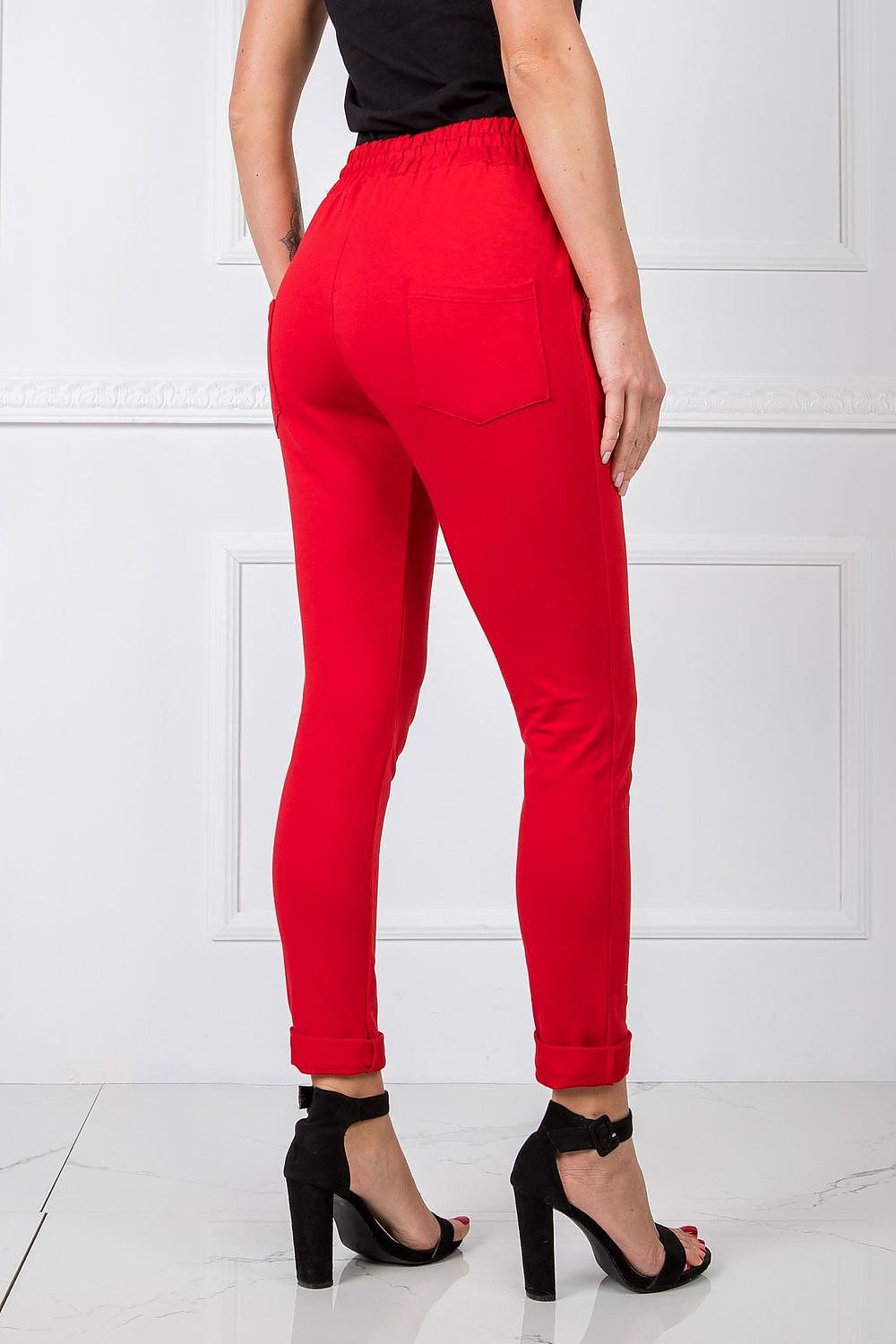 BFG Women’s High-Waisted Slim Leg Tracksuit Trousers in red, elegantly displayed with fashionable rolled cuffs, suitable for a chic, luxury athleisure style.
