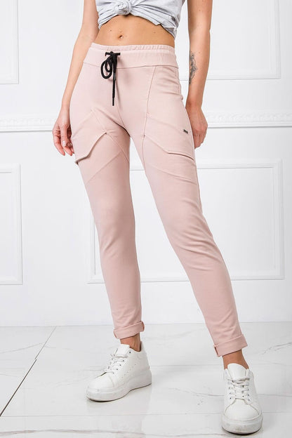 BFG Women's High-Waisted Cotton Blend Tracksuit Trousers with Slim Leg and Drawstring showcased in a soft pink colour, featuring a stylish cut and elastic waistband for comfort, perfectly paired with white sneakers.