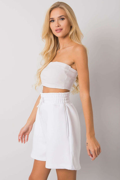 Side view of Elegant Cotton Women's Shorts with Elastic Waistband and Slip-On Pockets by BFG, showcased by a model with wavy blonde hair, highlighting its flattering fit and elegant design.
