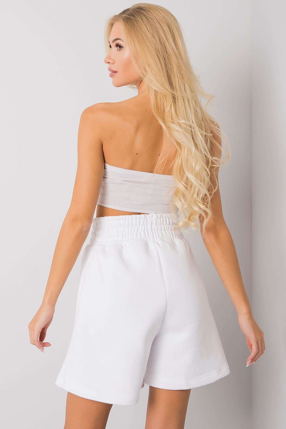 Back view of the Elegant Cotton Women's Shorts with Elastic Waistband and Slip-On Pockets by BFG, on a model who exudes elegance, showcasing the shorts’ comfortable and stylish silhouette.