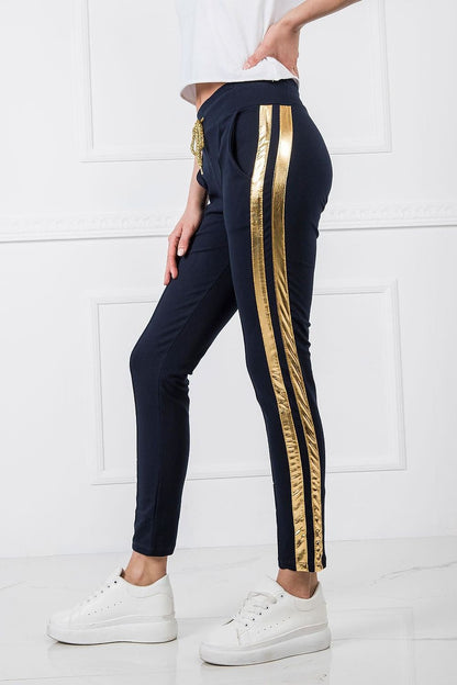 Luxury Women's Tracksuit Trousers with Elastic Waistband and Contrasting Side Stripes, displayed on a model, focusing on the sleek fit and stylish gold detailing on the sides.