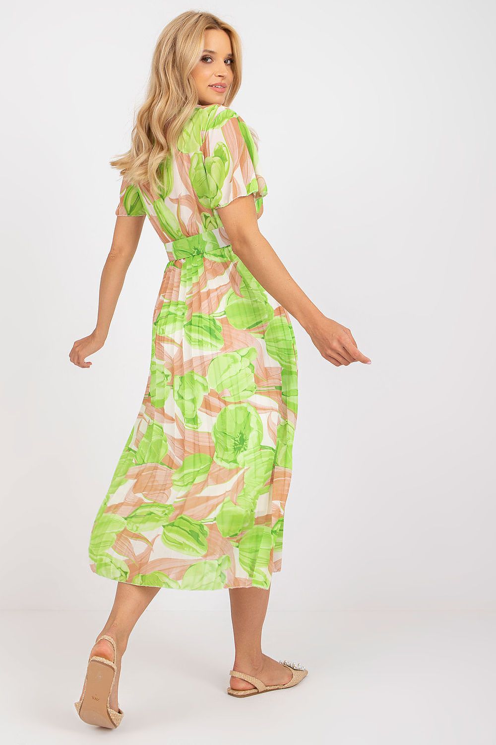 Elegant Summer Dress with Frill Sleeves, Envelope Neckline and Pleated Bottom by Italy Moda. Showcasing a model from the back, the dress features vibrant green and peach tones, highlighting the flowy pleated design, perfect for luxurious summer occasions.