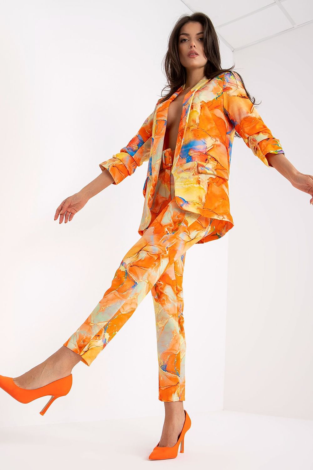 Luxury Italy Moda Straight Cut Jacket in Vibrant Fabric with 3/4 Sleeves - Perfect Match for Pants, model in motion, elegantly wearing an orange abstract patterned suit.