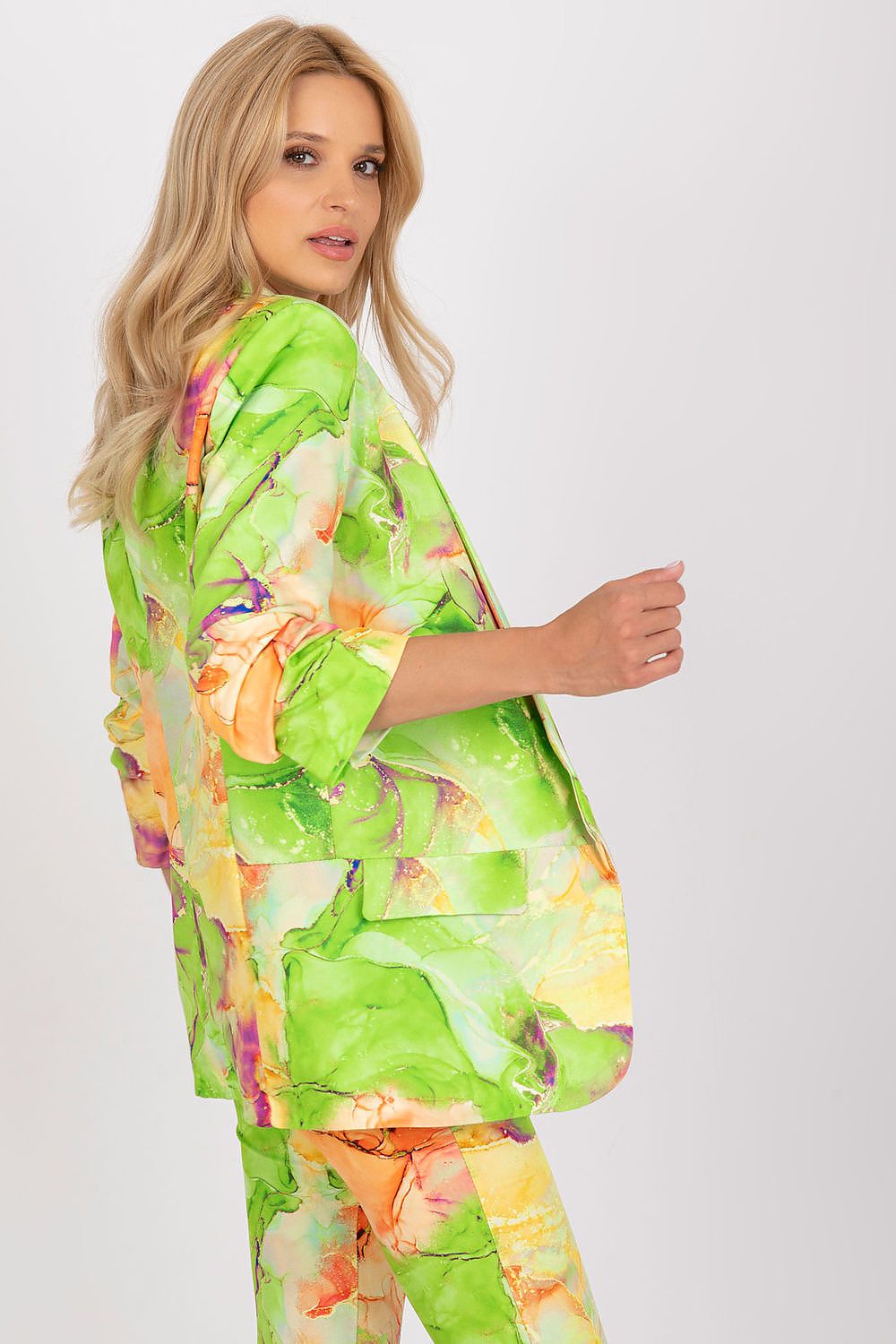 Luxury Italy Moda Straight Cut Jacket in Vibrant Fabric with 3/4 Sleeves - Perfect Match for Pants, model with blonde hair presenting a colourful green jacket and trousers.