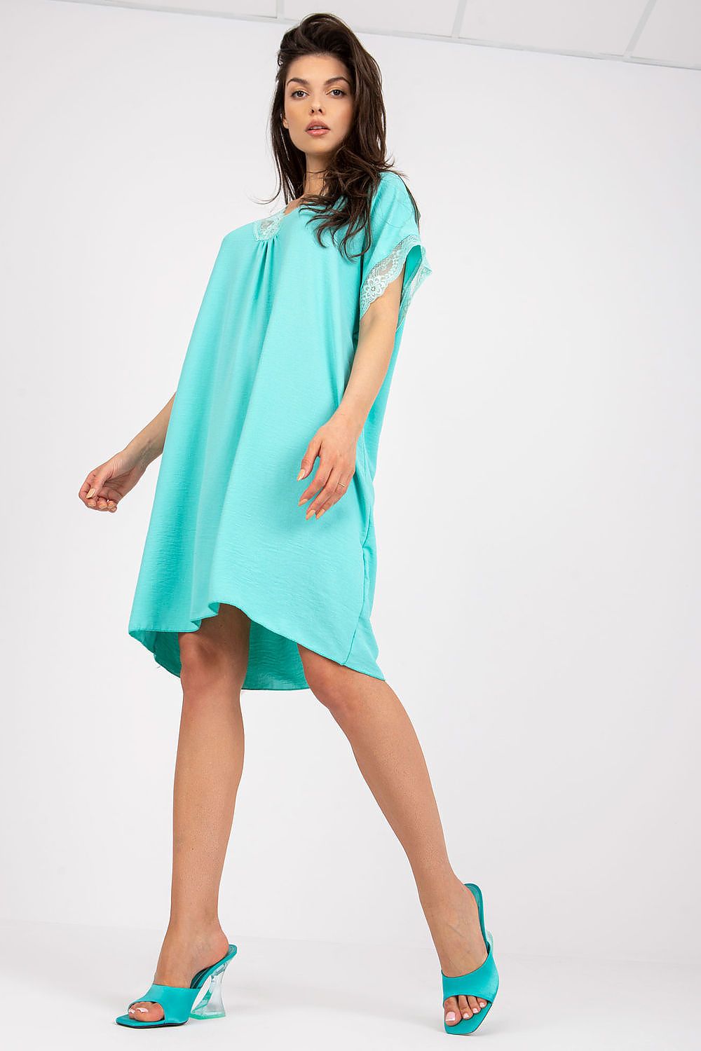 Elegant Loose-Fit Daydress by Italy Moda with Lace Trim and Heart-Shaped Neckline, in a vibrant turquoise shade, elegantly modelled by a woman showcasing its graceful silhouette and exquisite lace accents.