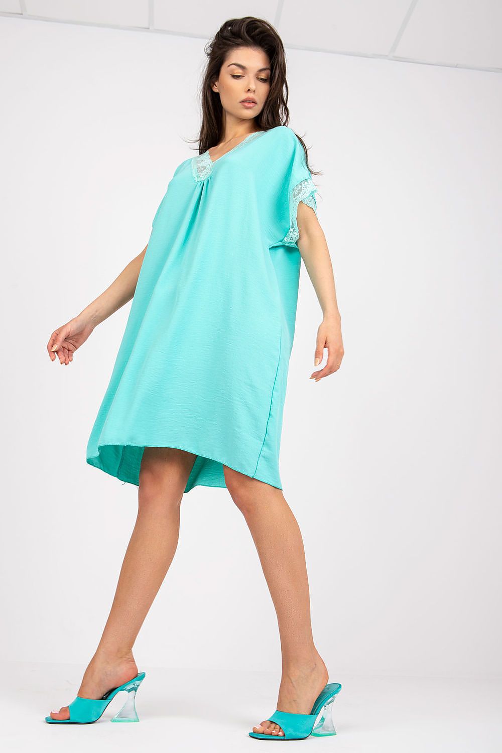 Elegant Loose-Fit Daydress by Italy Moda in vibrant turquoise, featuring a heart-shaped neckline and lace trim, styled with clear-heeled sandals for a chic summer look.