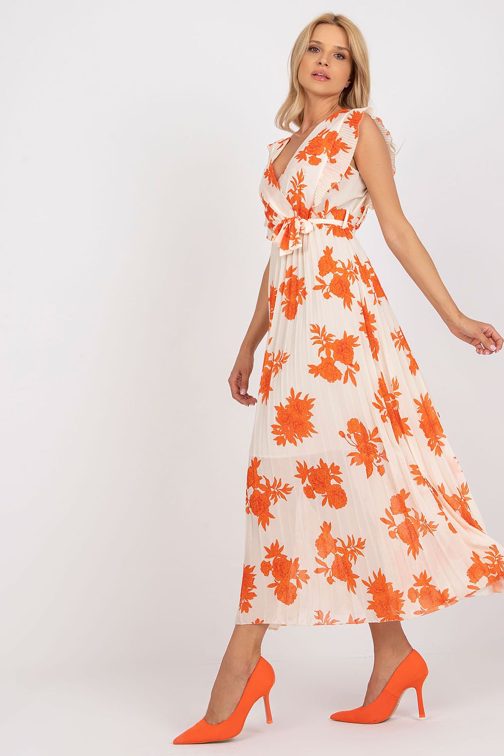 Elegant Long Summer Dress With Frilled Sleeves And Pleated Hem - Italy Moda, featuring a vibrant floral design in orange hues, complemented by chic high heels, perfect for sophisticated summer occasions.