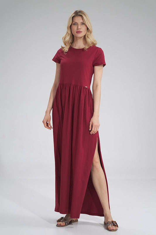 Luxury Figl Summer Cotton Maxi Dress featuring a pleated waist and stylish slit detail, model wearing short sleeves in a rich burgundy shade.