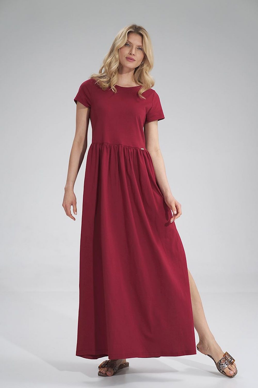 Luxury Figl Summer Cotton Maxi Dress featuring pleated waist and left side slit, model in red maxi dress with short sleeves.