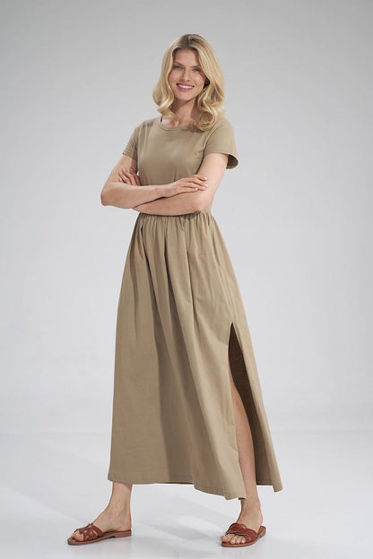 Luxury Figl Summer Cotton Maxi Dress displayed on a model smiling, wearing a beige short-sleeved dress with a stylish pleated waist and side slit.