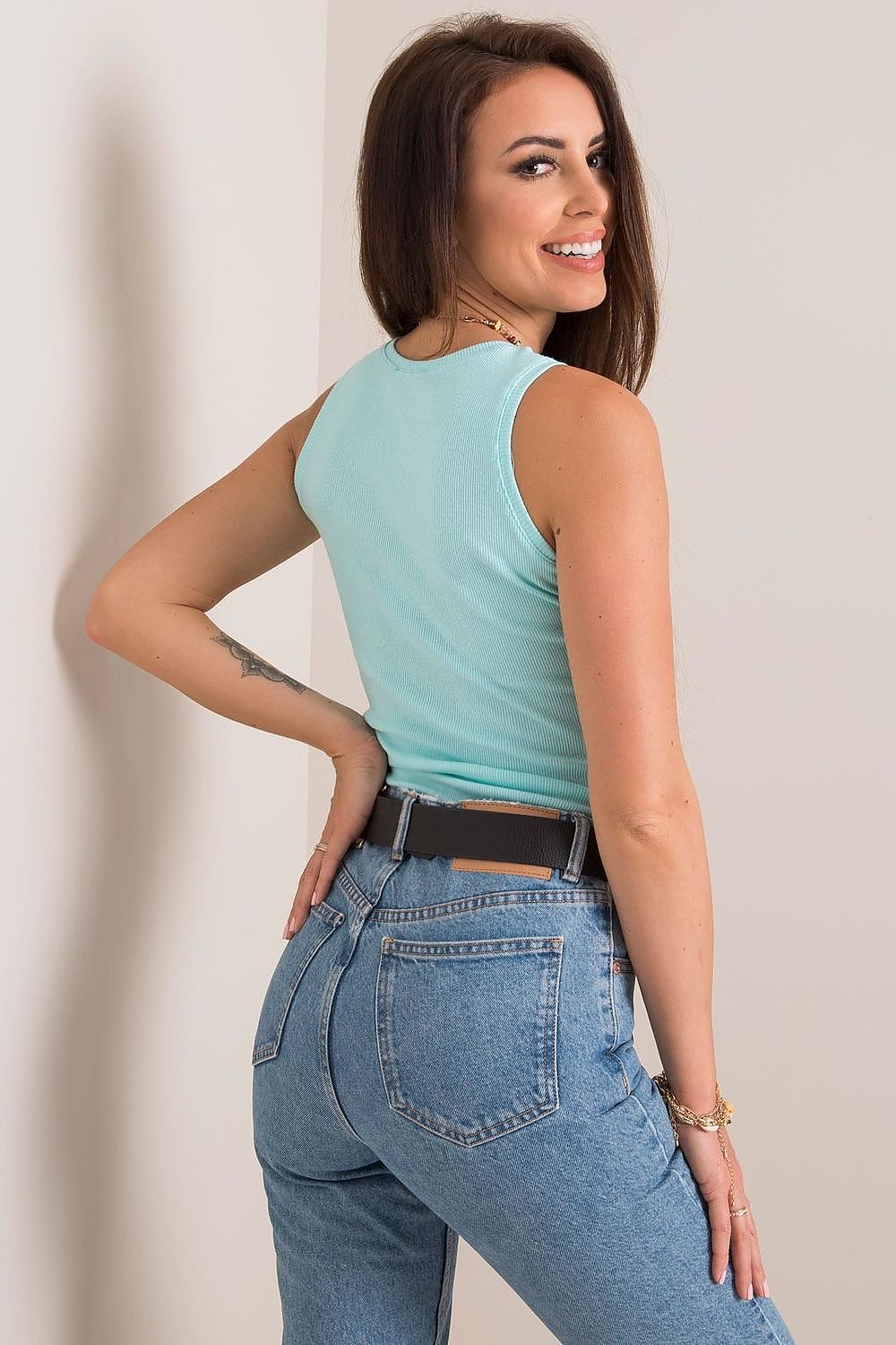 Luxury Cotton Sleeveless T-Shirt with Round Neckline, back view of a model in a light blue sleeveless top, highlighting the stylish design and perfect fit for summer.