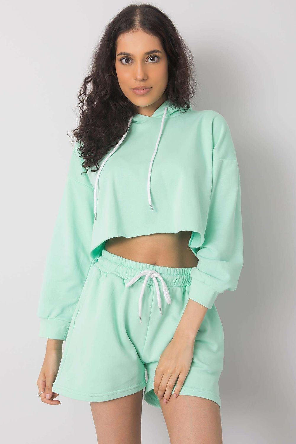 Luxurious Cotton-Blend Tracksuit Set showcasing a trendy mint green crop sweatshirt with a hood and coordinating shorts, ideal for a fashionable look - Ex Moda Fashion.
