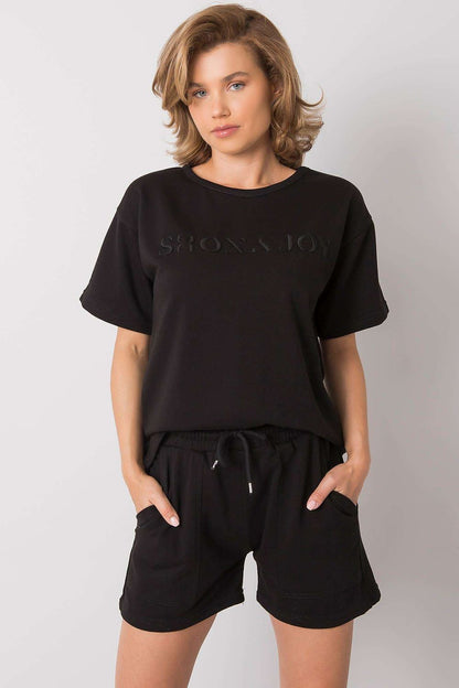 Luxury Summer Set: Short Sleeve Blouse & Shorts in 70% Cotton, elegantly styled in black, showcasing side pockets and an adjustable waist, presented on a model with a chic hairstyle.