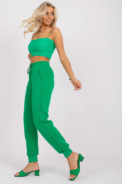 Ex Moda Women's Tracksuit Trousers - Cotton Blend, Elastic Waist, Slip-On Pockets showcased on a model in vibrant green attire, exuding a chic and casual look.