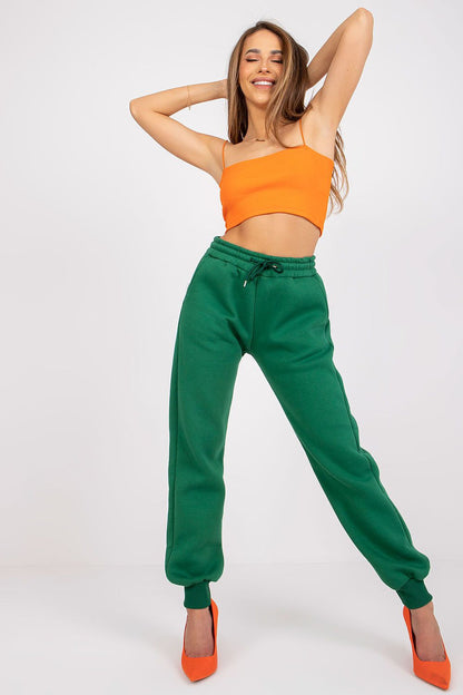 Ex Moda Women's Tracksuit Trousers - Cotton Blend, Elastic Waist, Slip-On Pockets complemented by an eye-catching orange top, showcasing a vibrant and fashionable look.