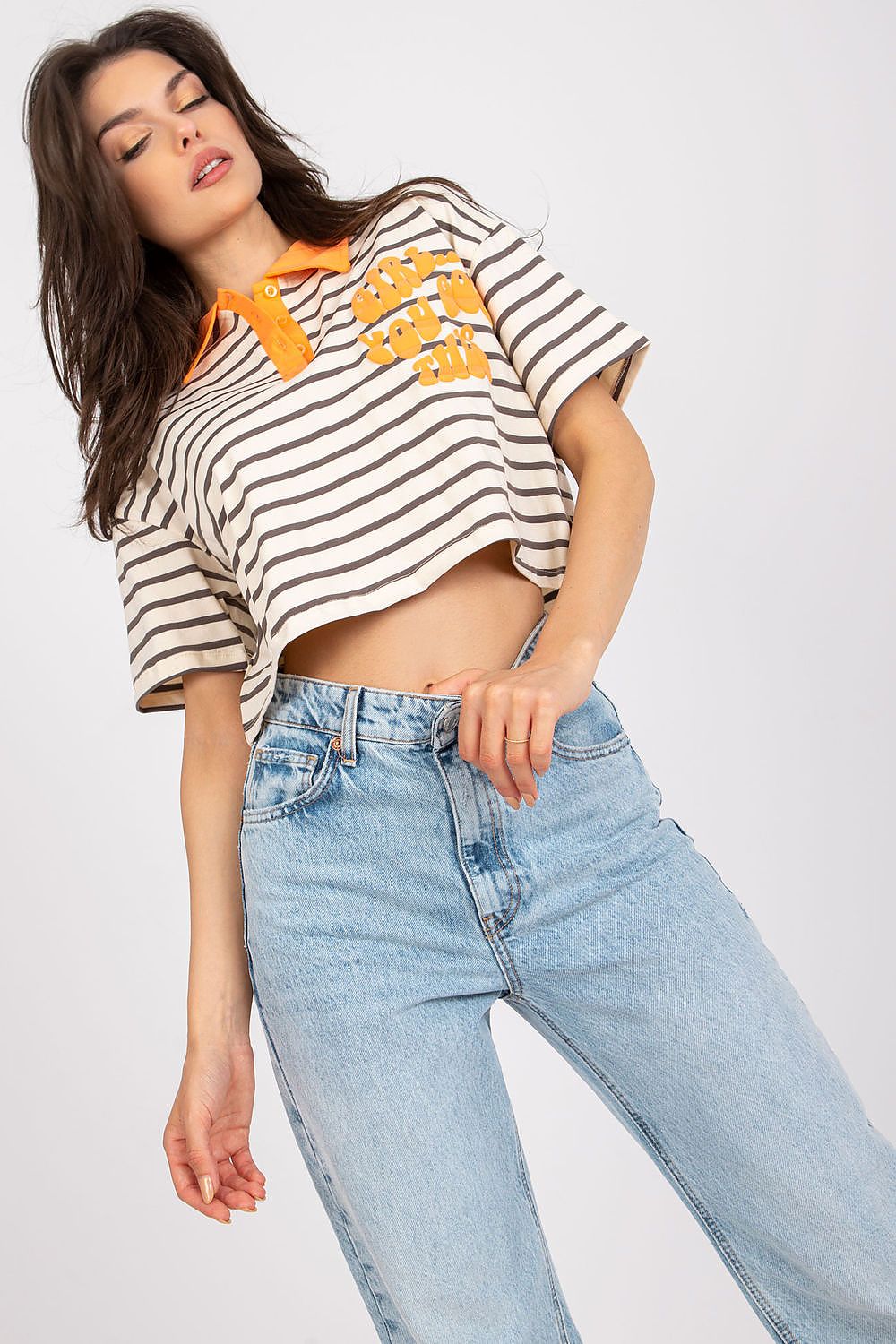 Stylish Striped Cotton Polo Blouse with Decorative Print – EU Size 0, featuring a model in a trendy cropped polo shirt with orange collar and text, paired with light blue jeans.