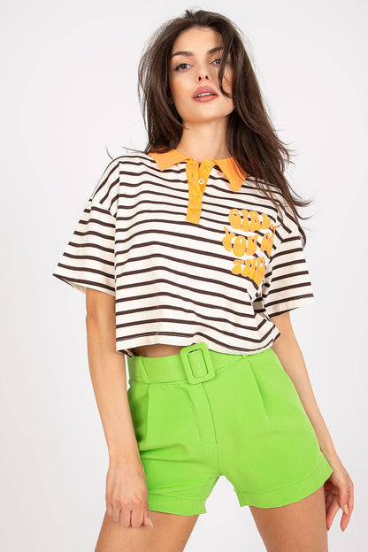 Stylish Striped Cotton Polo Blouse with Decorative Print – EU Size 0, presented by a model in a trendy pose, featuring a striped polo top paired with striking green shorts and an inviting smile.