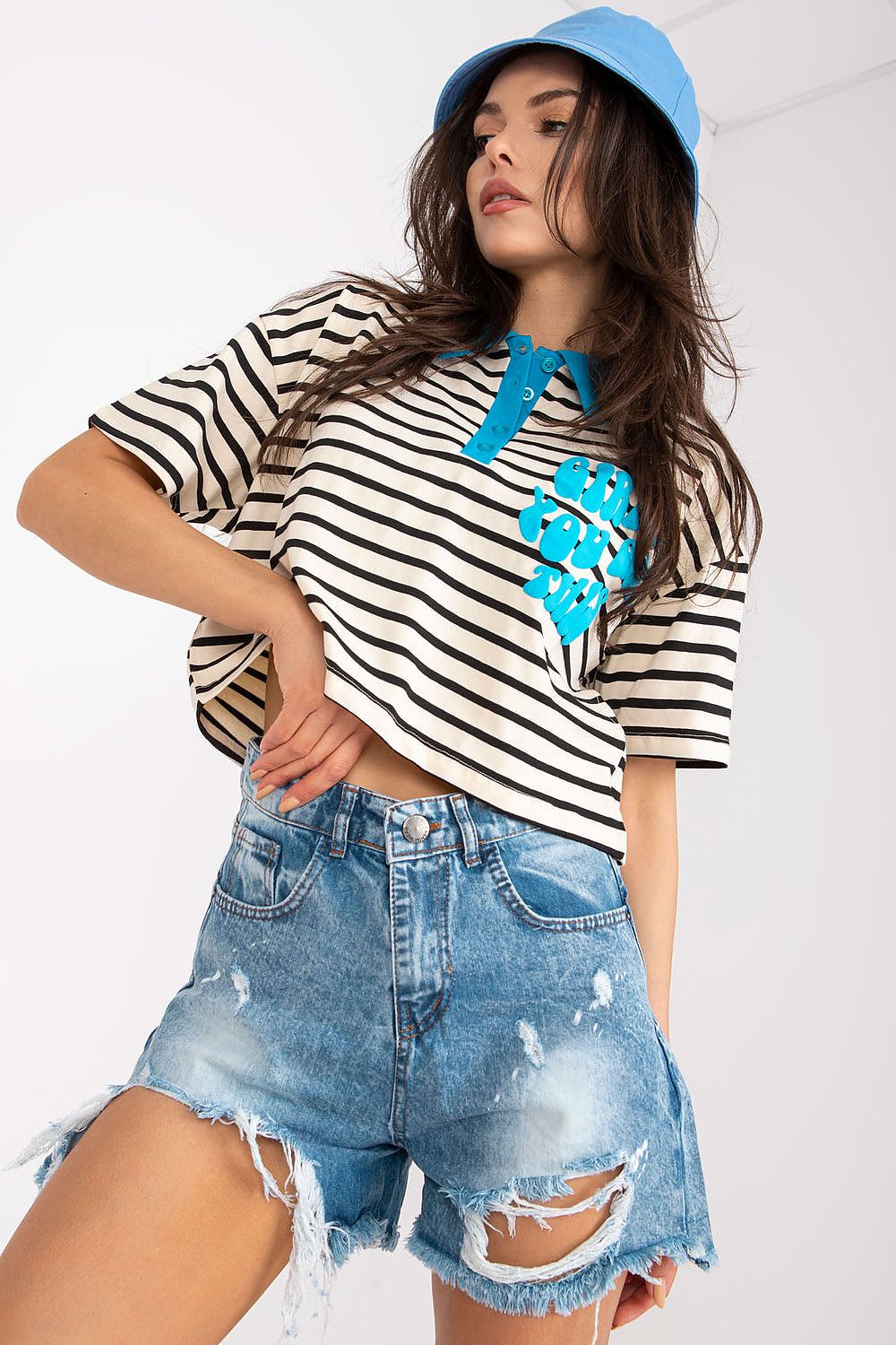 Stylish Striped Cotton Polo Blouse with Decorative Print – EU Size 0, featuring a model wearing a cropped version with denim shorts and a blue bucket hat.