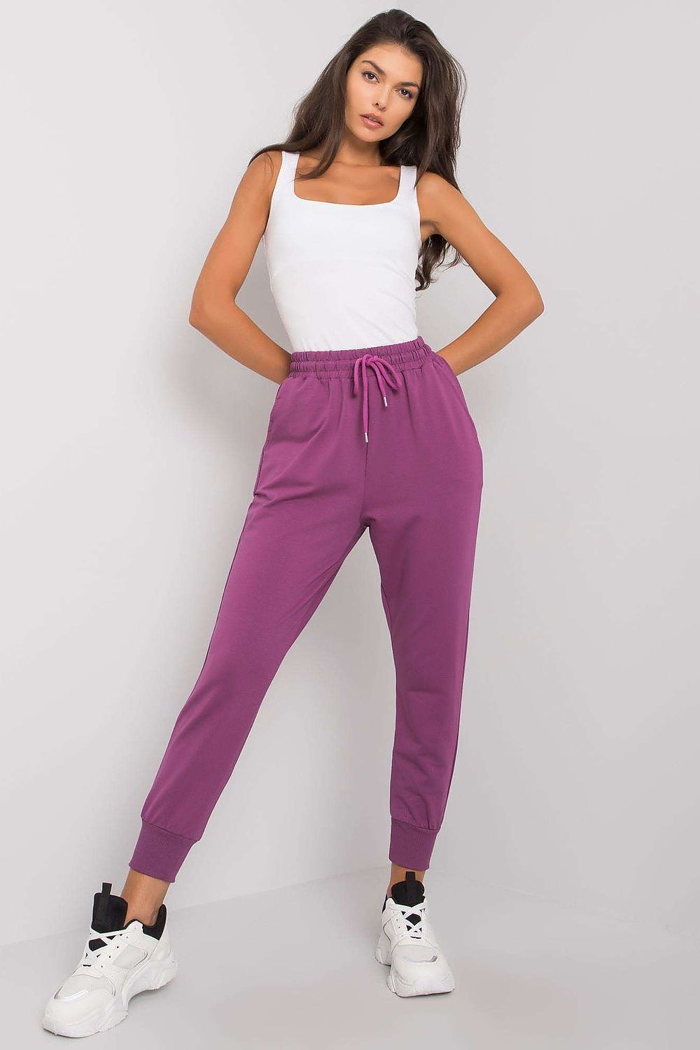 Luxury Tracksuit Trousers with Waist Tie and Elastic Band in vibrant purple, demonstrating a sleek silhouette and luxury feel for casual or active settings.