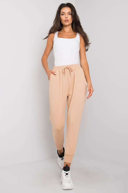 Luxury Tracksuit Trousers with Waist Tie and Elastic Band - Comfortable Cotton Blend Sweatpants model wearing light beige sweatpants with flattering fit and side pockets.