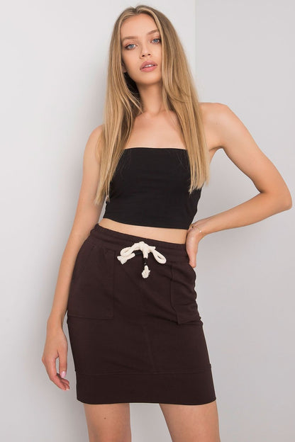 Elegant Mini Skirt with Elastic Waistband and Pockets - Cotton Blend for Comfortable Fit, elegantly displayed on a model wearing a black crop top, showcasing the sophisticated design and comfortable fit of this stylish skirt.