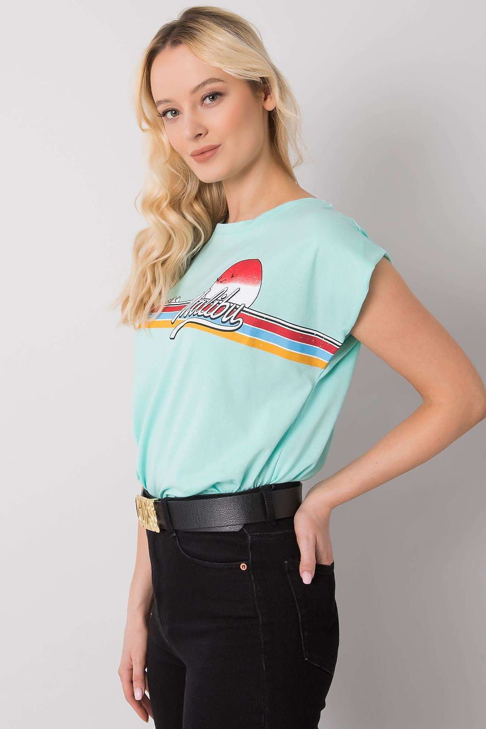 Luxury 100% Cotton Short Sleeve T-Shirt with Front Print, EU Size 0, Round Neckline, side profile of a model wearing a mint green T-shirt with a trendy print.