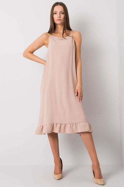 Elegant Cotton Summer Dress with Shoulder Straps and Frill Hem - Perfect for Everyday Wear. A stunning model showcases the dress featuring a delicate frill hem and stylish shoulder straps, exuding a luxurious summer vibe.