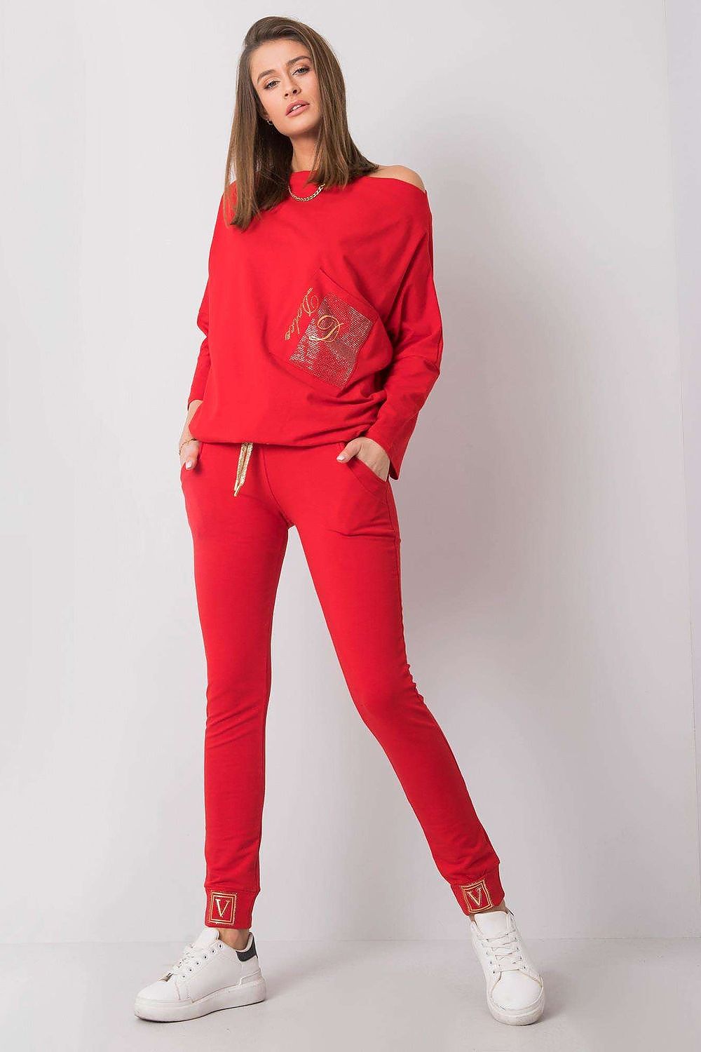 Luxury High Rise Sweatpants with Rhinestone Cuffs and Tie Waist - Cotton Spandex Blend, featuring a model posing confidently in red sweatpants paired with a chic off-shoulder top, accentuating the fashionable look.