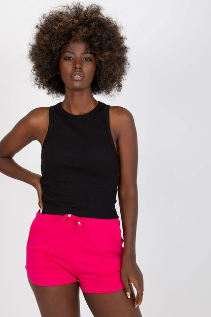 BFG Classic Ribbed T-Shirt in Black, crafted from a luxurious cotton and spandex blend, featuring a stylish round neckline and a fitted silhouette, elegantly showcased on a model wearing vibrant pink shorts.