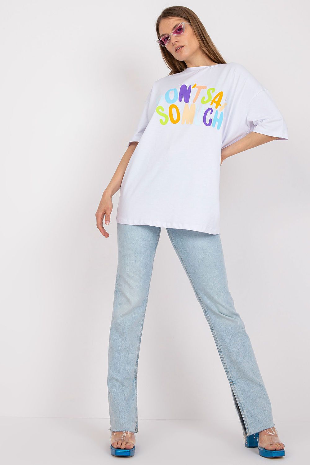 Chic Loose-Fit Ladies' T-Shirt featuring Decorative Front Wording, elegant model posing in a stylish outfit paired with flared jeans, designed for a luxurious casual look.