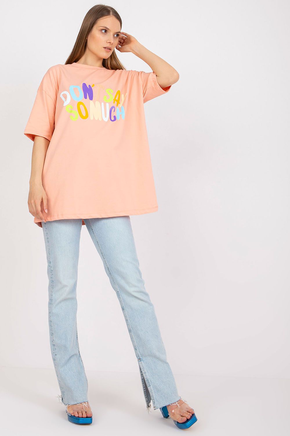 Stylish Loose-Fit Ladies' T-Shirt with Decorative Front Wording - Cotton & Spandex Blend, featuring a model in a peach t-shirt styled with flared jeans, showcasing the striking front wording.