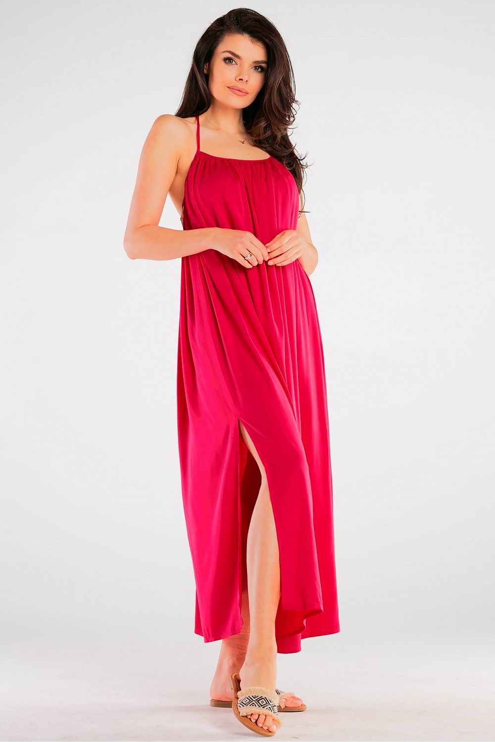 Elegant Maxi Dress by Awama in vibrant pink, elegantly styled with flowing fabric and a graceful side slit for effortless sophistication.