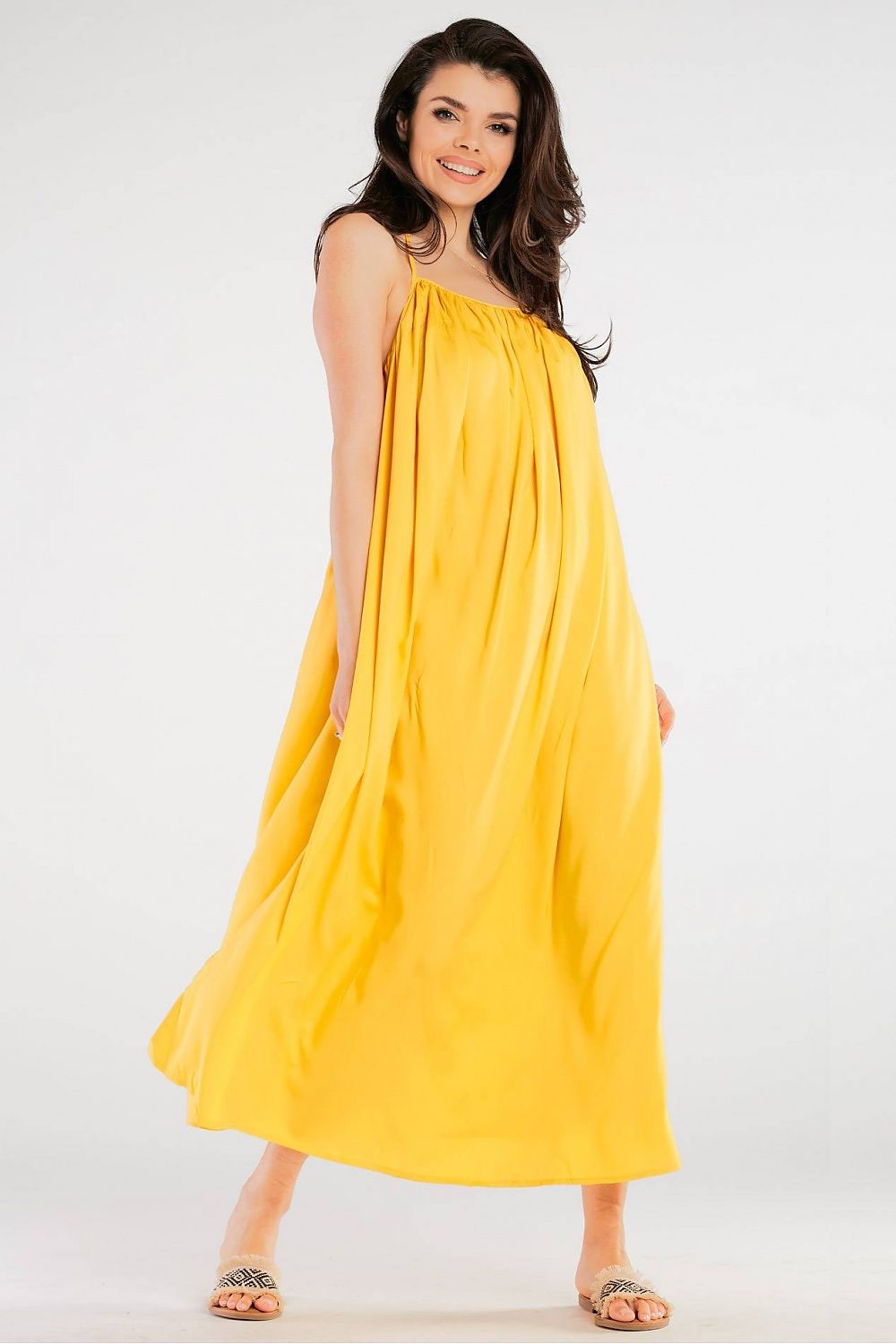 Charming model wearing the Elegant Maxi Dress by Awama in bright yellow, designed with a loose, airy fit for a fresh summer aesthetic.