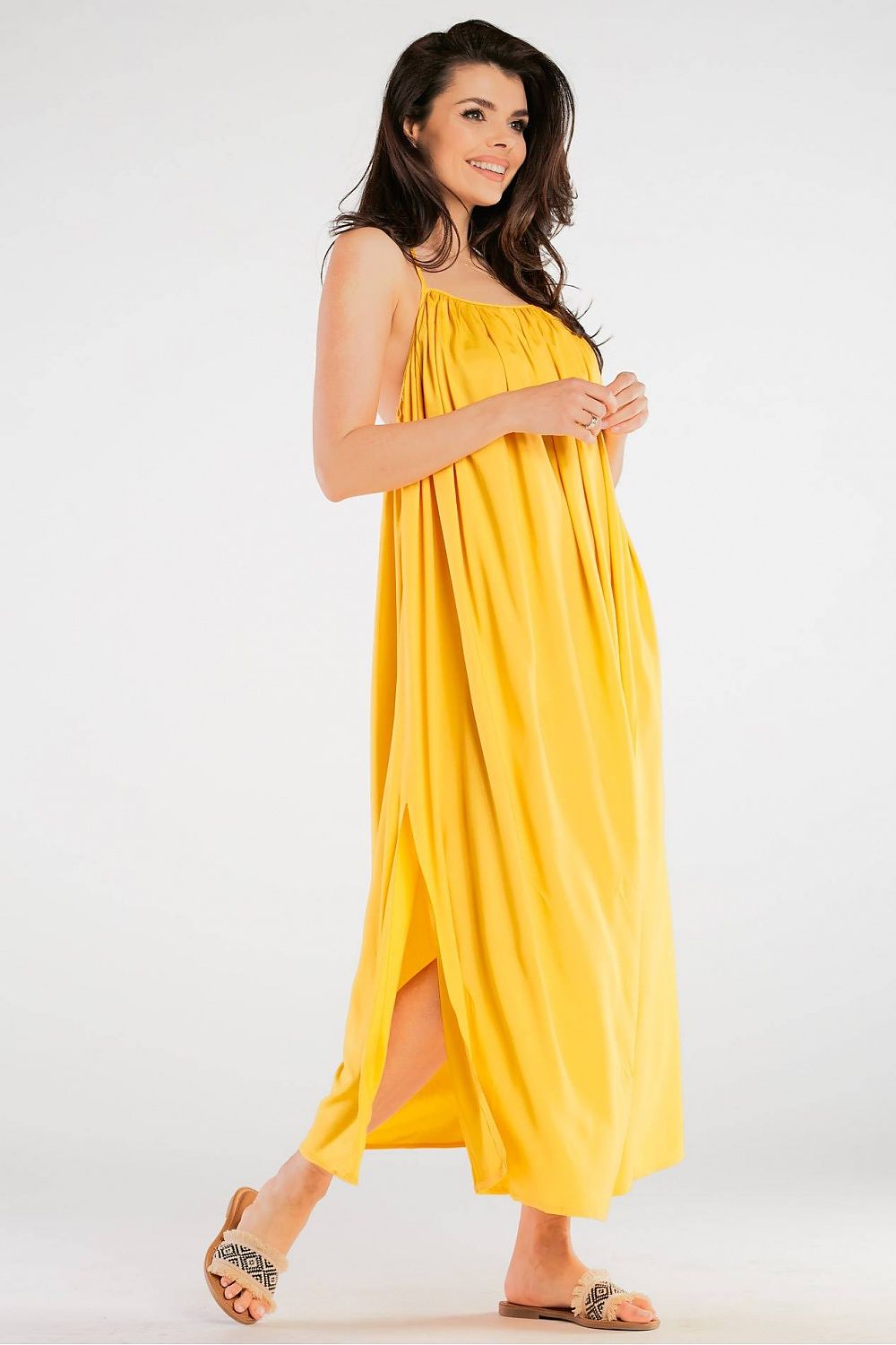 Elegant Maxi Dress by Awama in eye-catching yellow, featuring a stylish design with a side slit, embodying effortless elegance.