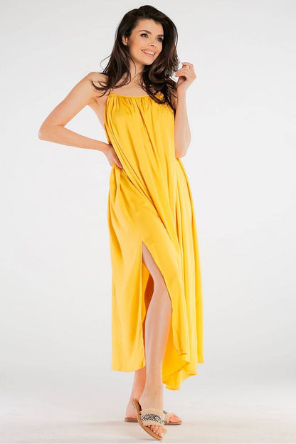 Front view of the Elegant Maxi Dress by Awama, highlighting the loose cut and vibrant yellow colour, perfect for a luxurious summer look.