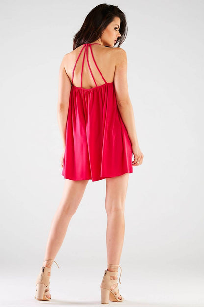 Chic back view of the Awama Loose Mini Dress, featuring a trapeze cut and decorative back straps, effortlessly embodying elegance in a striking red tone.