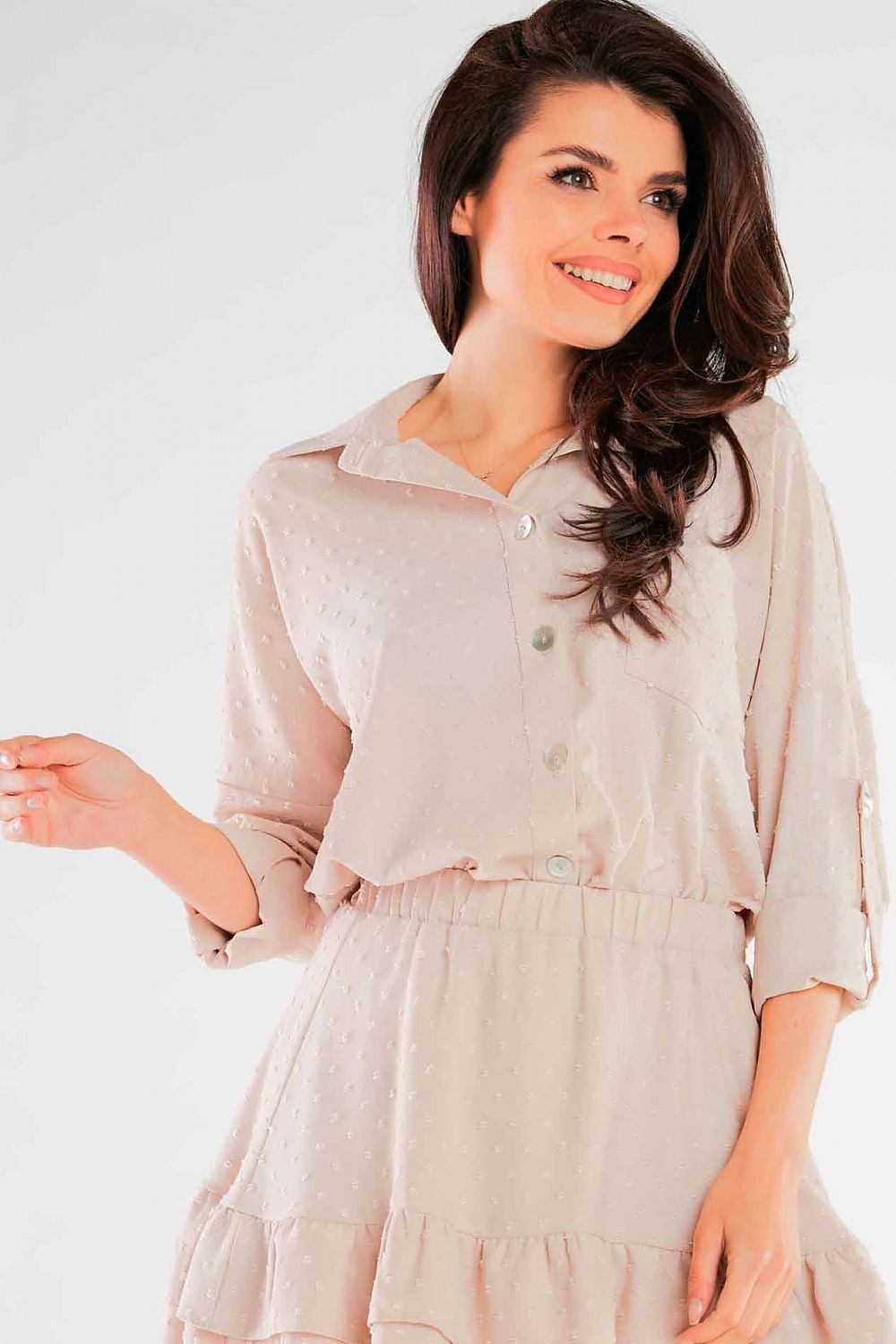 Close-up of the Luxury Lightweight Summer Shirt with Pocket and Decorative Buttons by Awama, with a model smiling while wearing a stylish beige shirt-dress, showcasing decorative buttons and comfortable fit.