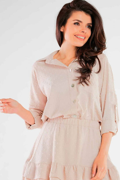 Close-up of the Luxury Lightweight Summer Shirt with Pocket and Decorative Buttons by Awama, with a model smiling while wearing a stylish beige shirt-dress, showcasing decorative buttons and comfortable fit.