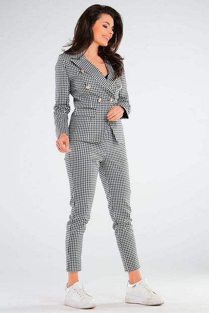 Side profile of the Luxury Double-Breasted Jacket by Awama with Wide Lapels & Golden Button Details, model's chic checkered suit epitomizing timeless sophistication.