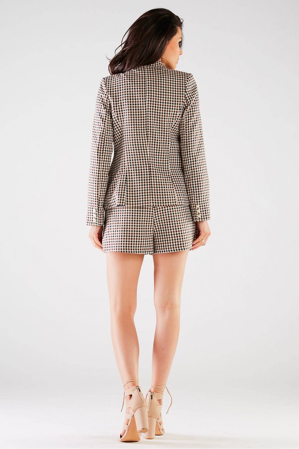 Back view of model wearing Elegant High-Waisted Loose-Fitting Shorts with Tie Waist and Pockets by Awama, paired with a complementary blazer, exuding elegance.